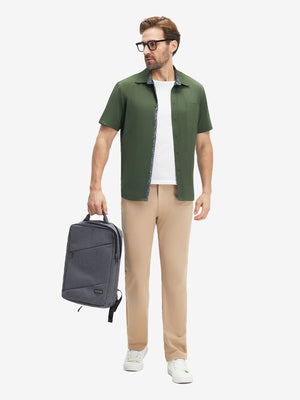 Front full body shot of model exercising in military green cool print plain button up shirts