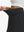 Detail view of elastic waistband on black women's stretch a-line golf skort with 7 pockets