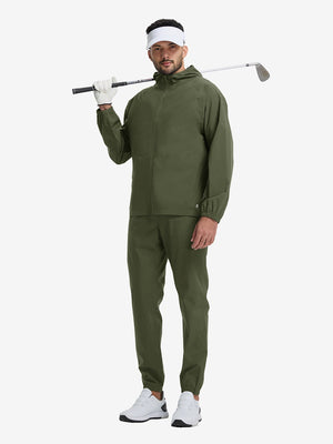 Full body shot of model playing golf in army green waterproof lightweight rain jacket with hood
