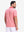 Front upper body shot of model wearing brick red moisture wicking jacquard golf shirts