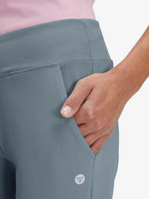 Side view of pocket on grey blue women's high waist stretch golf pants with pockets