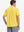 Model half-body back view wearing yellow cotton blend plain shirt.