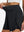 Detail view of elastic waistband on black women's gym golf shorts with liner pocket