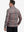 Back upper body angle of the red/black/white plaid full print quarter zip pullover, model turns head slightly.