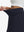 Detail view of elastic waistband on navy blue women's stretch a-line golf skort with 7 pockets