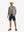Front full body shot of model exercising in grey cool print plain button up shirts