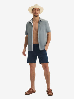 Front full body shot of model exercising in grey cool print plain button up shirts