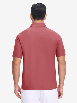Back upper body shot of model wearing brick red dry fit waffle textured collared golf shirts
