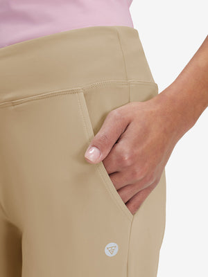 Side view of pocket on light khaki women's high waist stretch golf pants with pockets