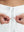 Detail view of elastic waistband on white women's lightweight athletic sweatpants