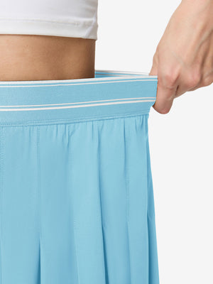 Detail view of elastic waistband on lake green women's moisture-wicking athletic tennis skirts