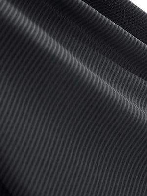 Close-up texture of light and dark grey women's q-zip pin striped texture golf shirts fabric showing pin striped weave detail.