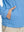 Model with both hands in pockets wearing youth full print stylish hoodies pullover in bluejay navy dogs.