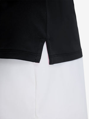 Detail view of hem on black women's athletic quarter zip tank tops