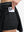 Detail view of inner pocket on black women's moisture-wicking athletic tennis skirts