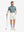 Front full body shot of model exercising in dark green oval premium ribbed collar print polo shirts