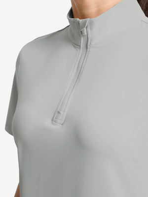 Detail view of neck zipper on light grey women's breathable 1/4 zip pullover golf shirts