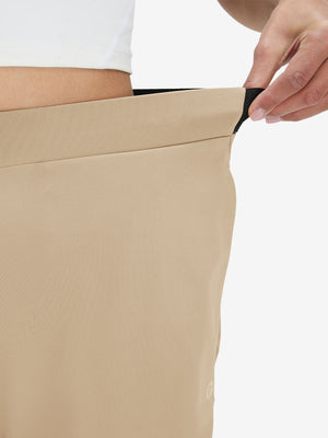 Detail view showing waist stretch on light khaki women's lightweight athletic sweatpants
