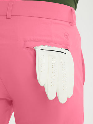 Close-up of the back pocket detail on the peach pink stretch soft flat front dress golf shorts, emphasizing storage