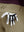 Detail view of back pocket on khaki flat front hybrid golf shorts