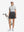 Front full body shot of model exercising in light grey women's 5 buttons collared polo shirts