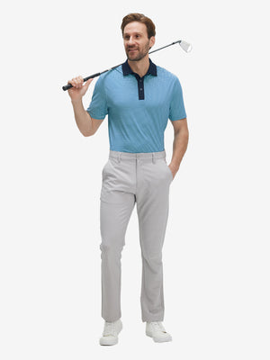 Full front: model in aqua stripe upgraded two-tone striped quick dry polo shirtholding golf club.