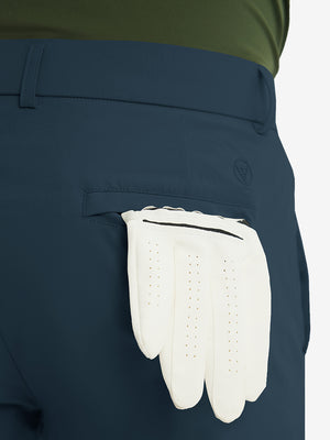 Rear view showing back pockets of navy stretch quick dry casual golf pants with 4 pockets