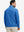 Back upper body angle of the line animal full print quarter zip pullover, model turns head slightly.