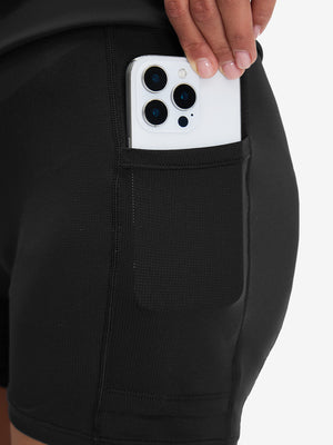 Side view of pocket on black high waist built-in short a-line golf skirt with 5 pockets