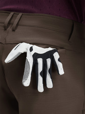 Detail view of back pocket on tobacco brown flat front hybrid golf shorts