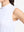 Detail view of armhole on white women's moisture-wicking mock neck sleeveless golf tops