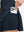 Detail view of inner pocket on navy blue women's high waisted golf skirts with 4 inner pockets