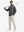 Full-body view of model in grey exclusive print kangaroo hoodies holding a golf club outdoors.