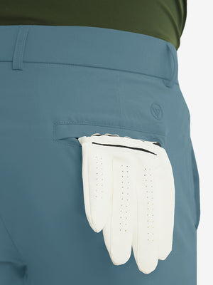Rear view showing back pockets of blue stretch quick dry casual golf pants with 4 pockets