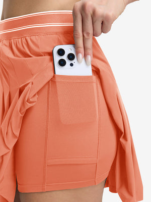 Detail view of inner pocket on peach pink women's moisture-wicking athletic tennis skirts