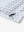 Hem slit detail of WHITE NAV CLUE Performance Quick Dry Print Golf Polo highlighting stitching and finish