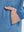 Hand in pocket detail of the Misty Blue Quarter Zip Polar Fleece Sweatshirt, soft fleece fabric.