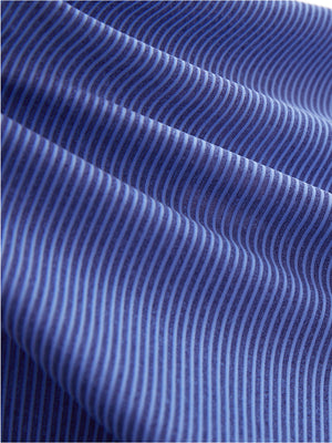 Close-up texture of light blue navy women's q-zip pin striped texture golf shirts fabric showing pin striped weave detail.