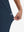 View showing loose fit of navy women's high waist stretch golf pants with pockets