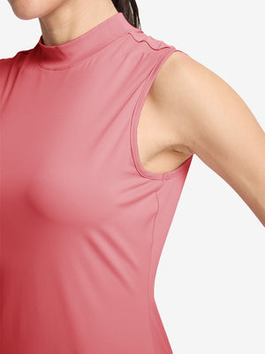 Detail view of armhole on pink women's moisture-wicking mock neck sleeveless golf tops