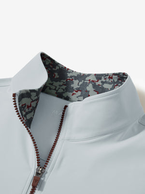 Collar zipper and inner neck pattern detail of the lightweight golf quarter zip pullover in misty grey.