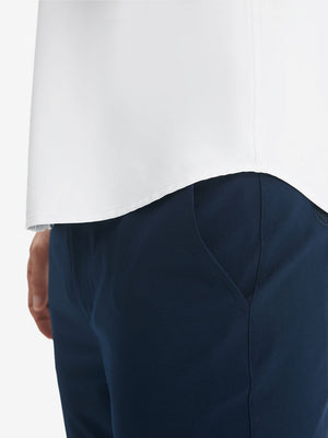 Detail view of hem on white cool print plain button up shirts