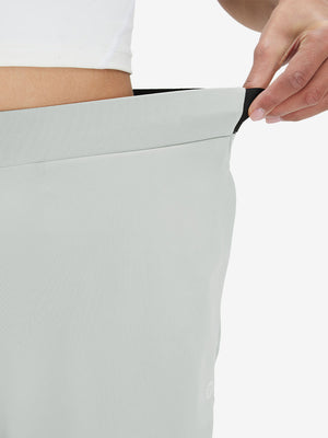 Detail view showing waist stretch on silver gray women's lightweight athletic sweatpants