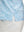 Detail view of hem on blue antichoke premium ribbed collar print polo shirts