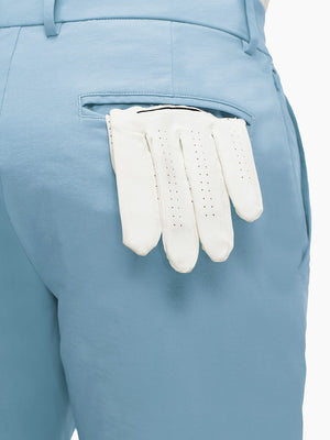 Detail view of back pocket on sky blue flat front flex cotton blend golf shorts