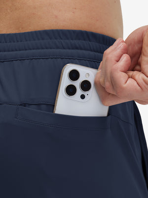 Back view of pocket on navy 4 way stretch breathable workout athletic shorts