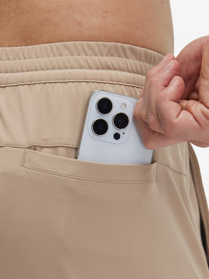 Back view of pocket on light khaki 4 way stretch breathable workout athletic shorts