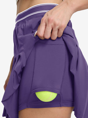 Detail view of inner pocket on dark purple women's moisture-wicking athletic tennis skirts