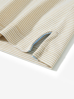 Detail view of hem on beige white comfy breathable pin-stripe texture golf polos