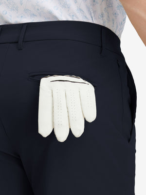 Detail view of back pocket on navy stretch cotton blend slim fit golf trousers 5 pockets